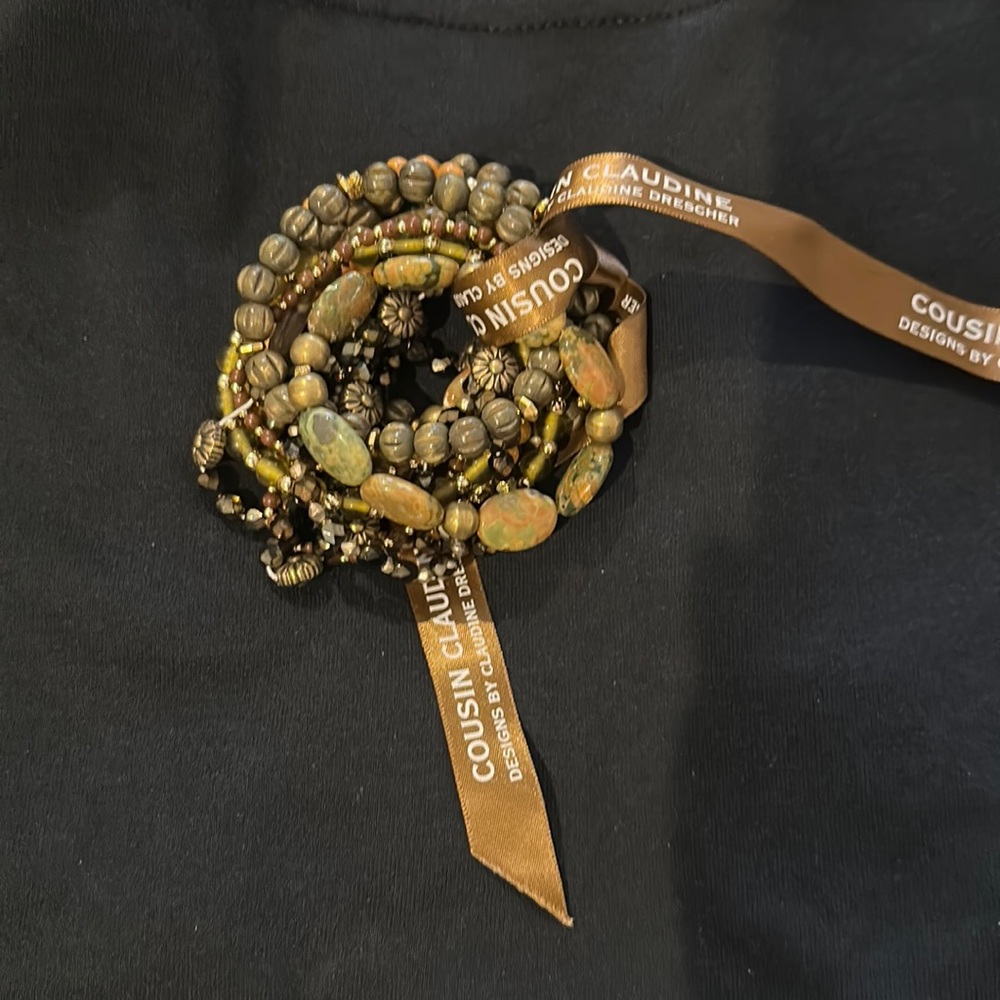 Cousin Claudine brown, green, gold and orange beaded bracelet set.  13 pieces.